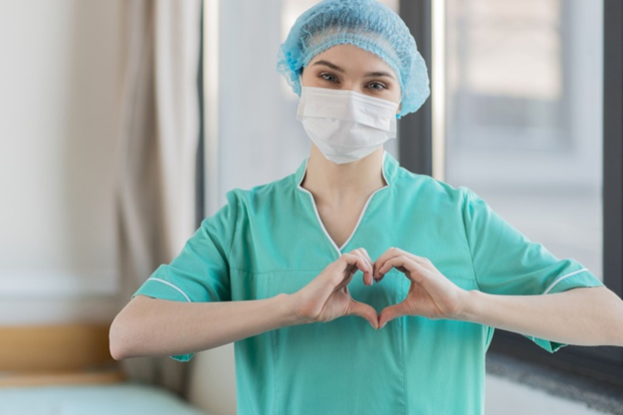 nurse-with-hands-heart-shape_23-2148501079-freepix.jpg